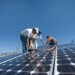 A group of men working on solar panelling